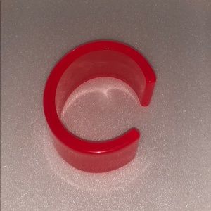 Orange bangle , cuff.  clear.